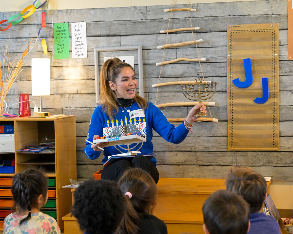 Guest speaker taking about Hanukkah to Pre-Kindergarten at Tower Hill Shcool.