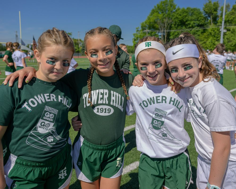 Students at an athletics events with friends at Tower Hill School.