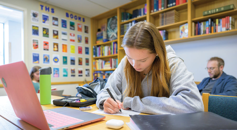 Upper school student in an academic class at Tower Hill School.